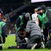 Rodrigo Bentancur receives treatment on the pitch in Tottenham's game against Liverpool