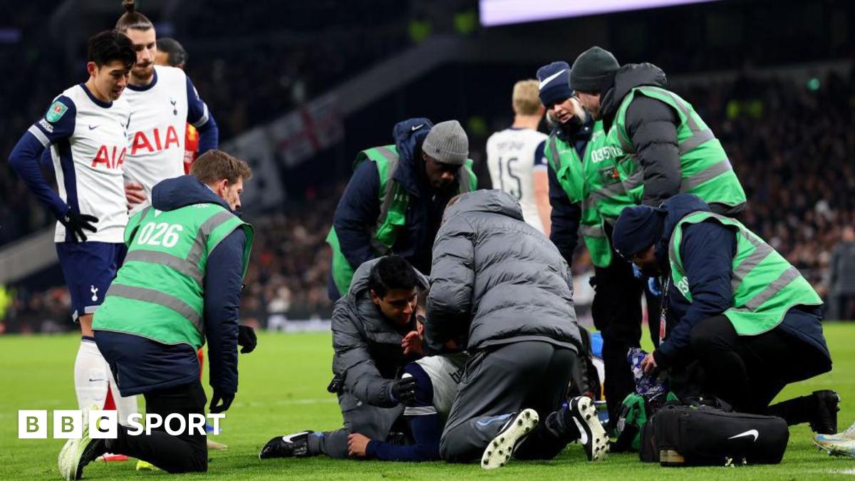 Rodrigo Bentancur receives treatment on the pitch in Tottenham's game against Liverpool