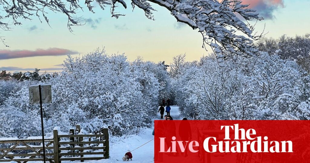 UK weather warnings in place as country hit by snow and freezing rain – live updates