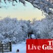 UK weather warnings in place as country hit by snow and freezing rain – live updates