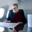 Prime Minister Sir Keir Starmer working on a government plane on his way to the G20 summit in Rio in November 2024. Pic: Reuters