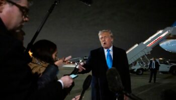 Donald Trump speaks to reporters next to Air Force One after arriving back at Joint Base Andrews. Pic: AP Photo/Ben Curtis