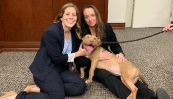 Prosecutors K.C. Pagnotta and Jessica K. Rock pose with one of the victims, named Baby Shark. Pic: Facebook/Paulding District Attorney's Office