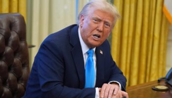 President Donald Trump speaks to reporters as he signs executive orders in the Oval Office of the White House, Tuesday, Feb. 4, 2025, in Washington. (AP Photo/Evan Vucci)