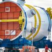 The first new nuclear reactor for a British power station for over 30 years arrives by barge at Combwich Wharf on the River Parrett, Somerset. Picture date: Friday February 24, 2023. Weighing 500-tonnes the reactor pressure vessel is where the nuclear fusion process will happen, creating the heat to make steam for the worlds largest turbines inside Hinkley Point C power station. Picture date: Friday February 24, 2023.