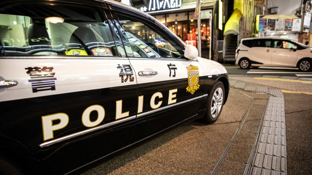 A police car in Shinjuku ward, Japan, in front of police station.