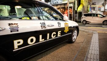 A police car in Shinjuku ward, Japan, in front of police station.