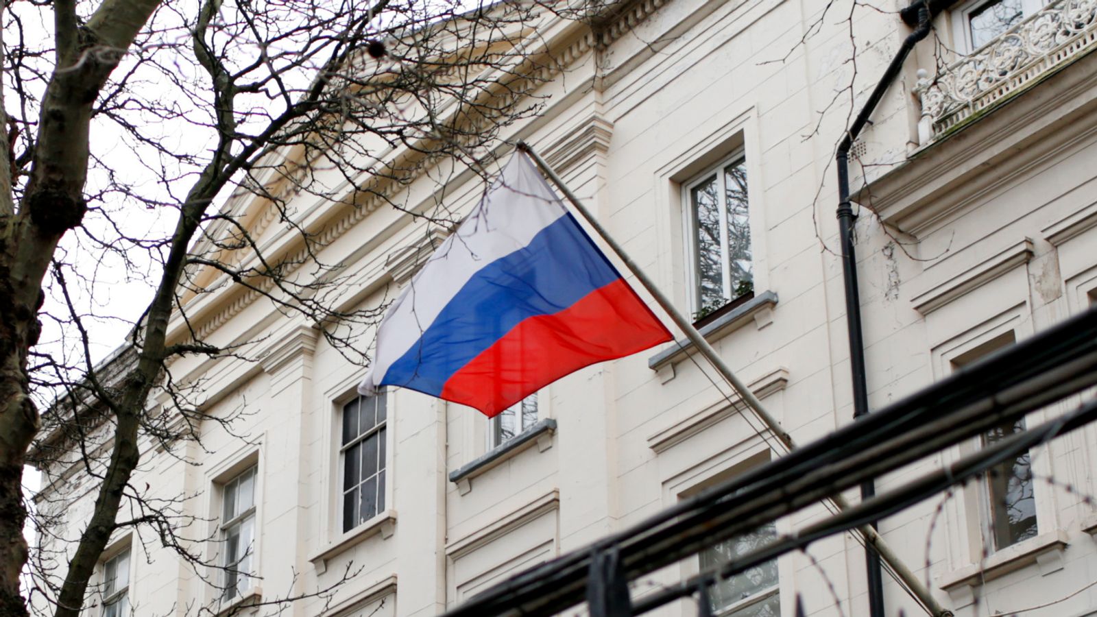 A Russian flag flies outside the Consular Section of the Russian Embassy in London, Tuesday, Feb. 22, 2022. British Prime Minister Boris Johnson says the U.K. will introduce "immediate" economic sanctions against Russia, and warned that President Vladimir Putin is bent on "a full-scale invasion of Ukraine." (AP Photo/David Cliff)