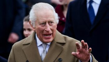 Britain's King Charles waves on the day he attends the Royal Family's Christmas Day service at St. Mary Magdalene's church, as the Royals take residence at the Sandringham estate in eastern England, Britain December 25, 2024. REUTERS/Toby Melville