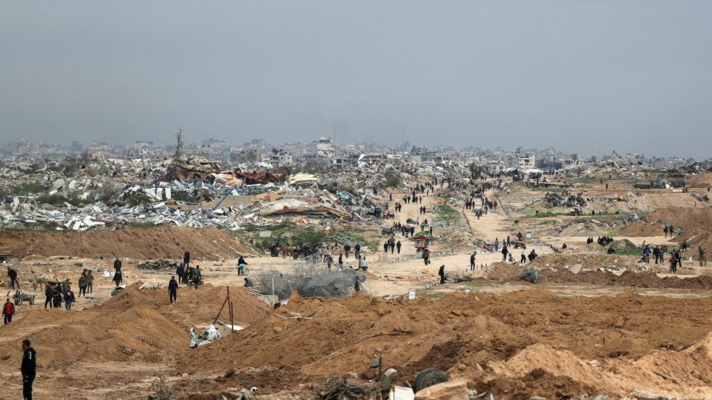 Palestinians return to their home after Israeli forces withdrew from the Netzarim corridor. Pic: Reuters