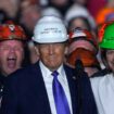 Donald Trump stands on stage with steelworkers as he speaks at a campaign rally in Pennsylvania. Pic: AP