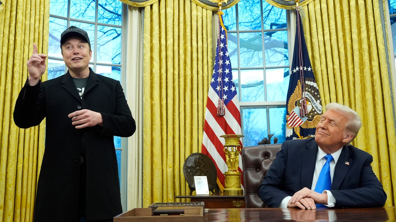 President Donald Trump listens as Elon Musk speaks in the Oval Office at the White House, Tuesday, Feb. 11, 2025, in Washington. (Photo/Alex Brandon)