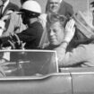 JFK waves from car in a motorcade in Dallas shortly before being killed. Pic: AP/Jim Altgens