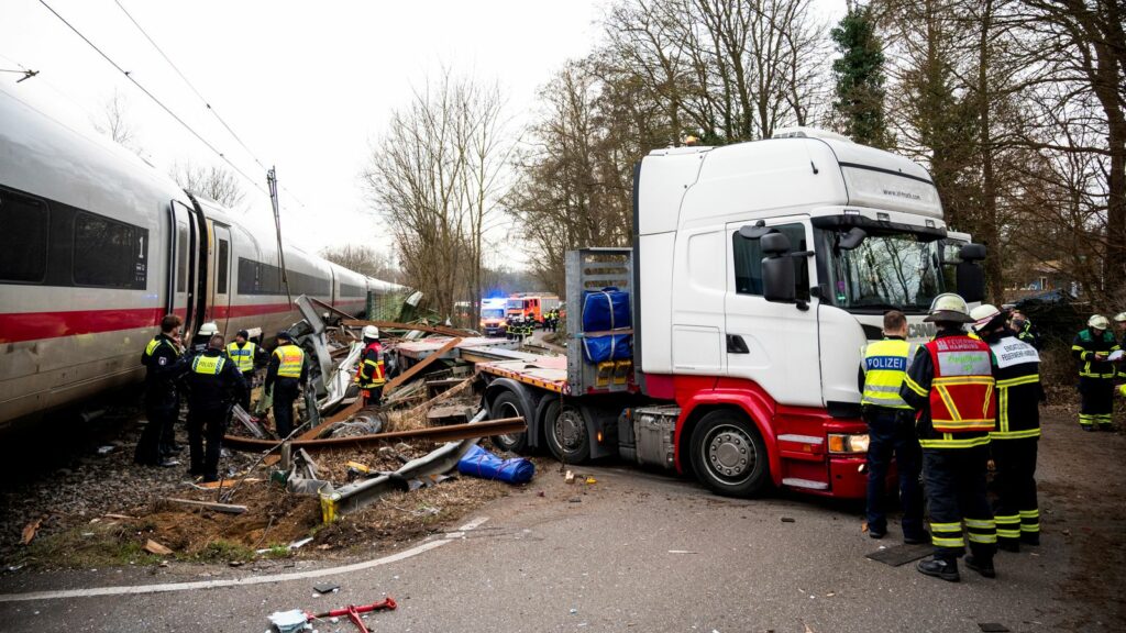 11 February 2025, Hamburg: Emergency services stand at the scene of an accident at a level crossing. One person has been killed and several injured in a collision between an ICE train and a truck. Photo by: Daniel Bockwoldt/picture-alliance/dpa/AP Images