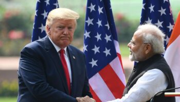 US President Donald Trump (L) shaeks hands with India's Prime Minister Narendra Modi listens during a joint press conference at Hyderabad House in New Delhi on February 25, 2020. (Photo by Prakash SINGH / AFP)