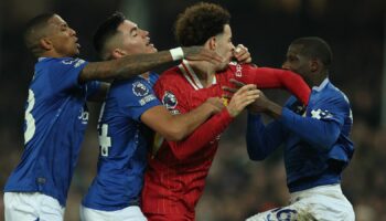 Liverpool's Curtis Jones clashes with Everton's Abdoulaye Doucoure after the match. Pic: Reuters