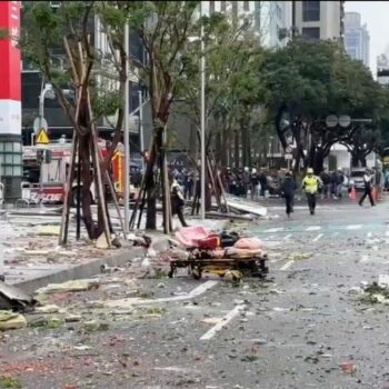 This image taken from video by Taiwan's TVBS shows the debris are strewn across the streets in the aftermath of an explosion at the Shin Kong Mitsukoshi department store in Taichung city in Taiwan on Thursday, Feb. 13, 2025. (TVBS via AP )