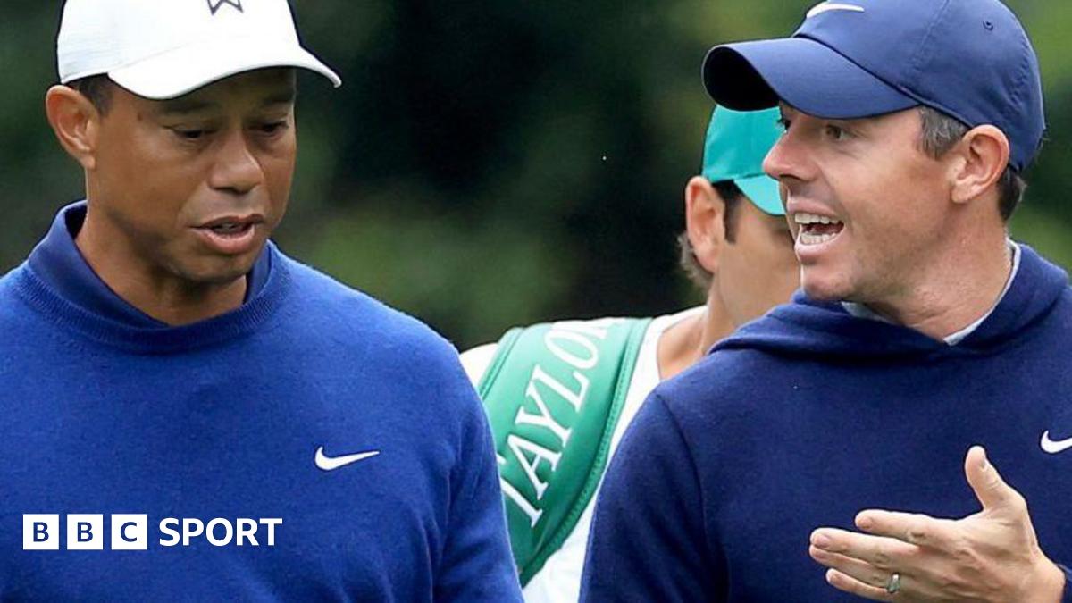 Tiger Woods and Rory McIlroy chat during a practice round at Augusta National