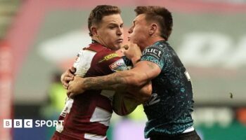 Jai Field carries the ball for Wigan Warriors against Leigh Leopards