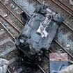 Travel chaos between two major cities after car plunges onto railway tracks - as driver is arrested